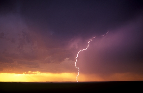 Lightning bolt at sunset over the badlands